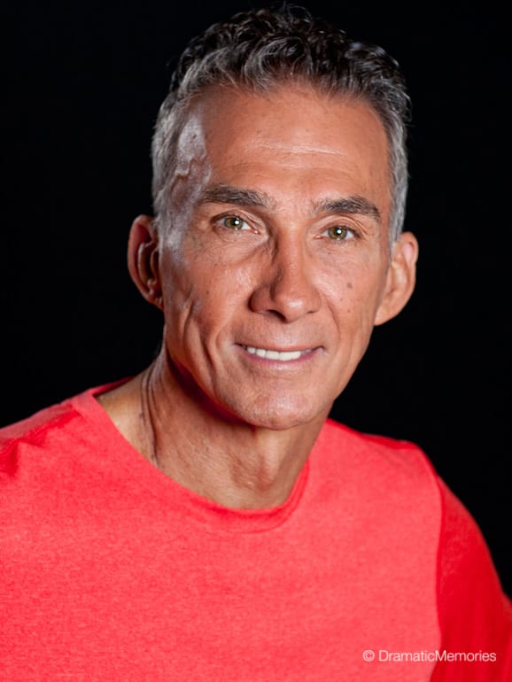 smiling middle aged man in a red t-shirt
