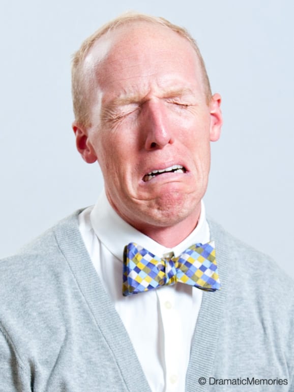 crying actor in white shirt and bow tie