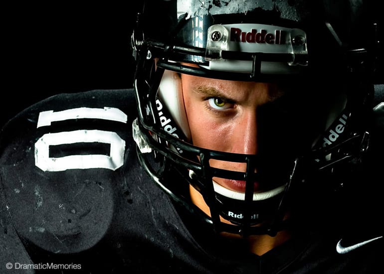 football player glaring through helmet