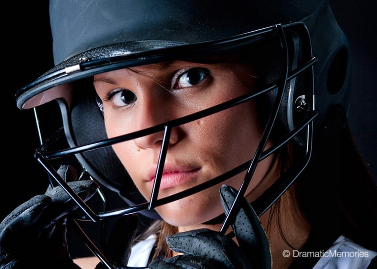 close-up of girl softball player wearing a batting helmet